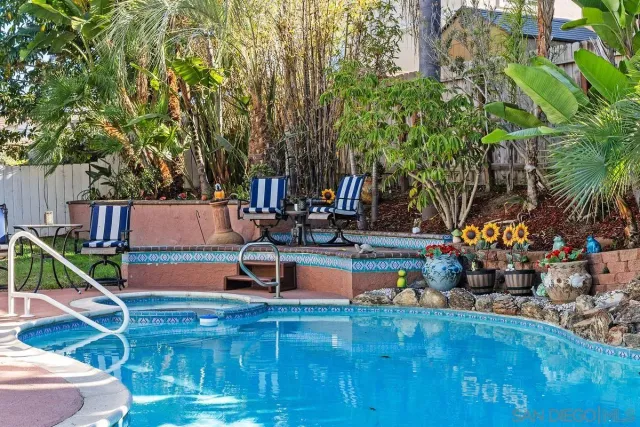 a view of swimming pool with a patio