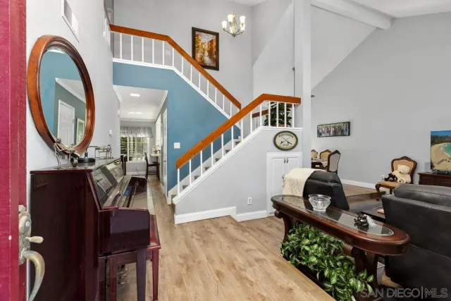 a view of hall way with furniture