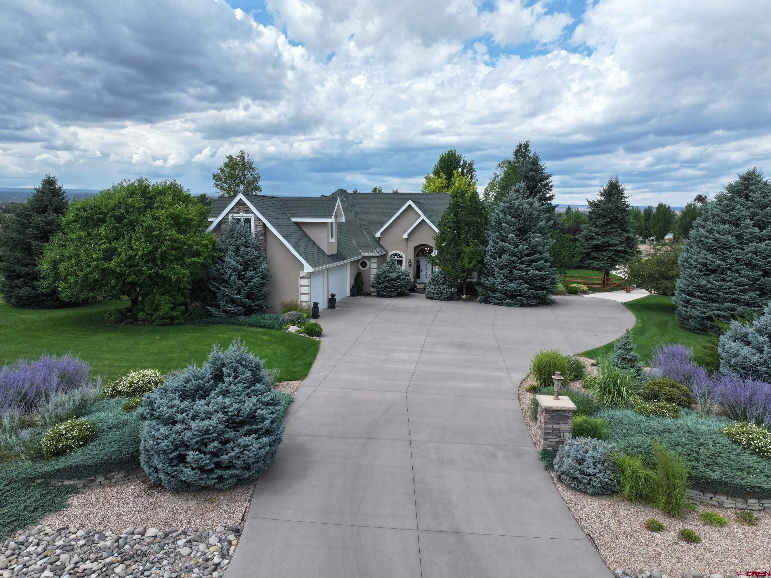 15103 6260th Road Montrose, CO 81403 - Photo 2 of 45 a view of a garden with a pathway
