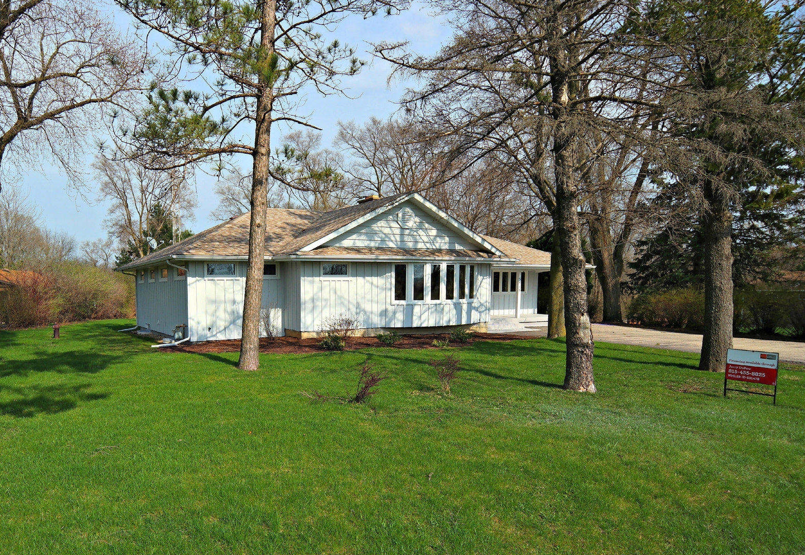3516 Lily Pond Road Woodstock, IL 60098 - Photo 1 of 20 a house that is sitting in the grass
