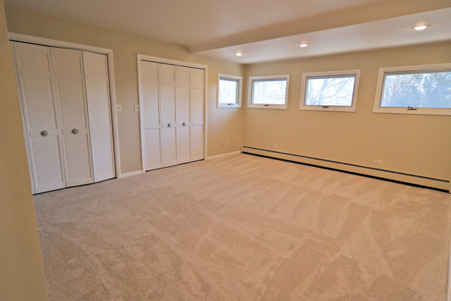 3516 Lily Pond Road Woodstock, IL 60098 - Photo 14 of 20 a view of an empty room with a window