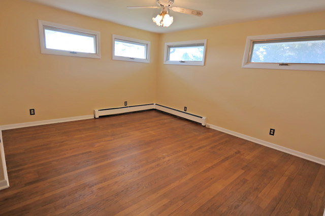 3516 Lily Pond Road Woodstock, IL 60098 - Photo 17 of 20 a view of an empty room with a window