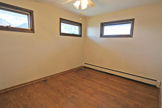3516 Lily Pond Road Woodstock, IL 60098 - Photo 18 of 20 a view of an empty room with a window