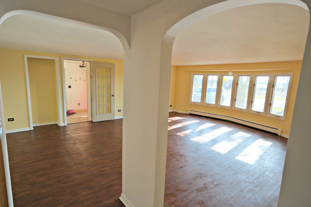 3516 Lily Pond Road Woodstock, IL 60098 - Photo 5 of 20 a view of entryway with wooden floor