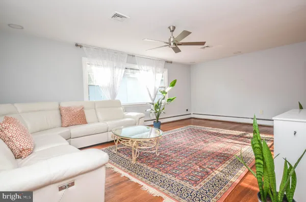 a living room with furniture and a rug