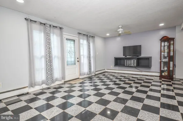 a large white checkered floor with a black white checkered floor