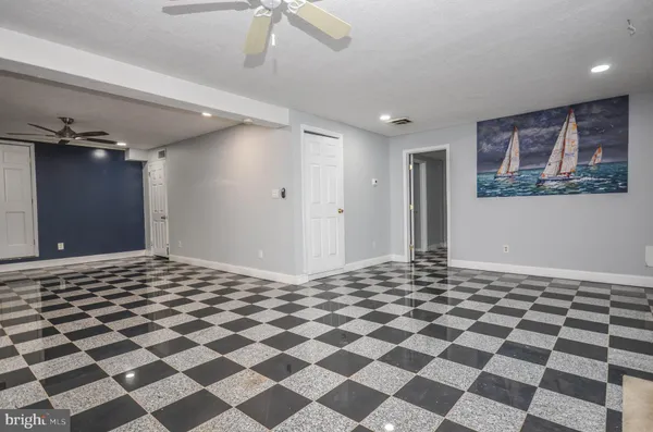 a room with a black white checkered floor