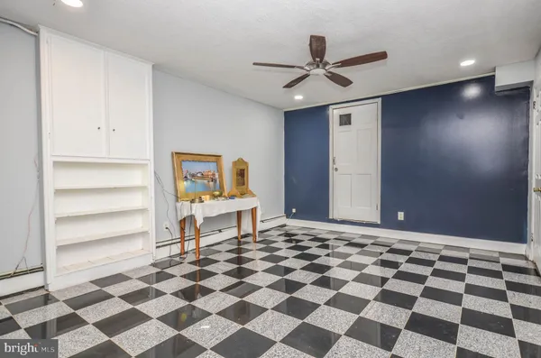 a very nice looking room with a black and white checkered floor