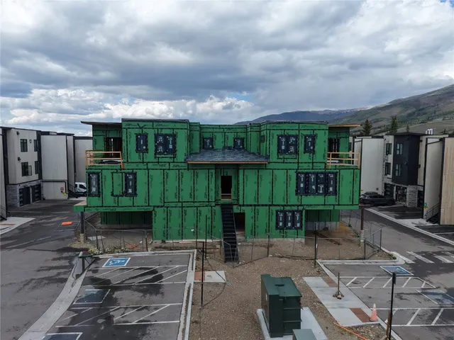 an outdoor view of a house with sitting area