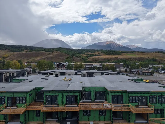a view of multiple houses with a city street