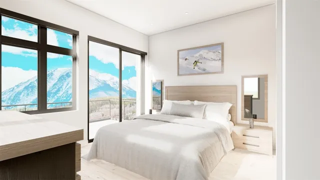 a bedroom with a large bed and a large window