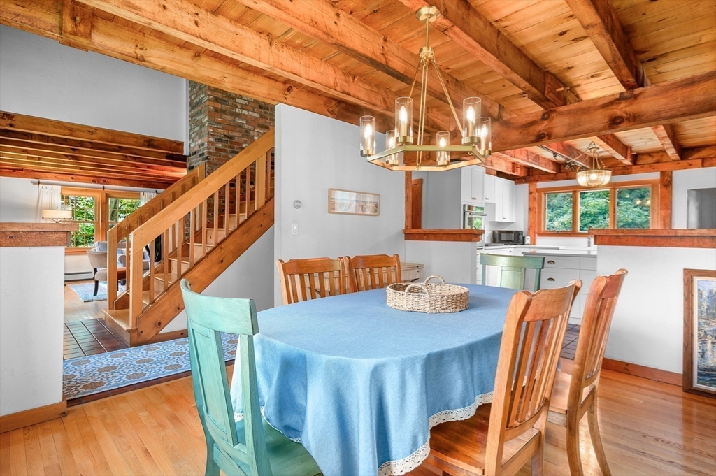 17 Cedar Point Circle Barnstable, MA 02632 - Photo 16 of 41 a view of a dining room with furniture a chandelier and wooden floor