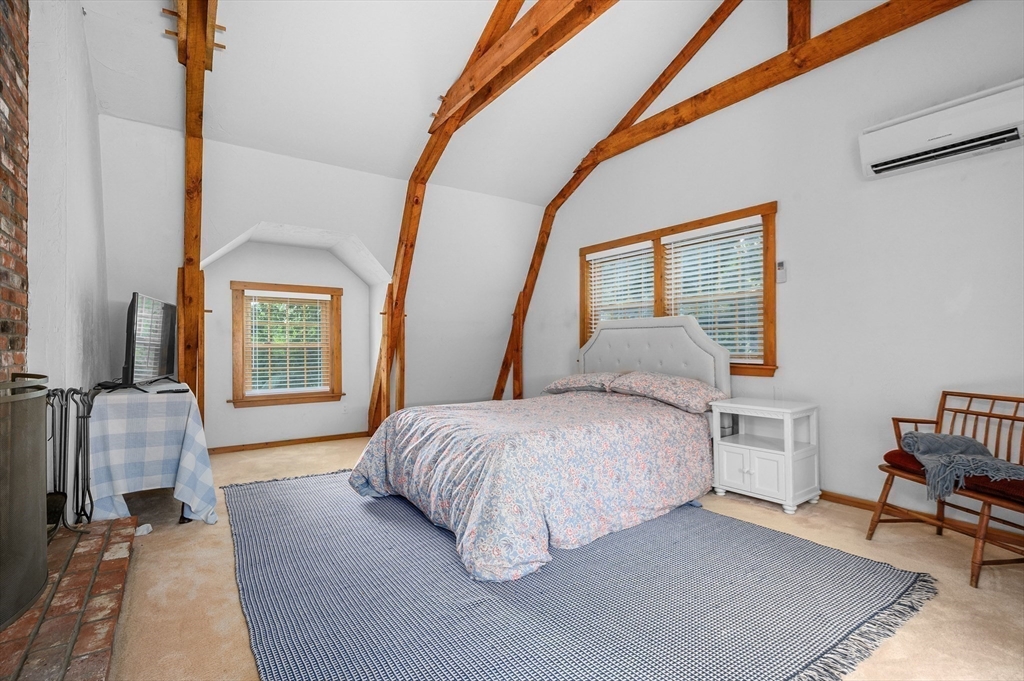 17 Cedar Point Circle Barnstable, MA 02632 - Photo 23 of 41 a bedroom with a bed and a couch