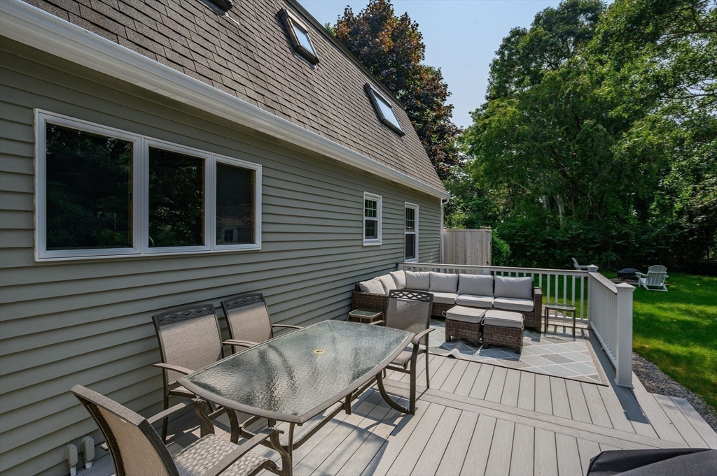 17 Cedar Point Circle Barnstable, MA 02632 - Photo 30 of 41 a backyard of a house with wooden floor outdoor seating and barbeque oven