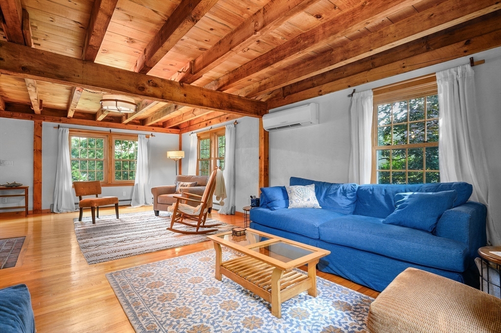 17 Cedar Point Circle Barnstable, MA 02632 - Photo 9 of 41 a living room with furniture and a table