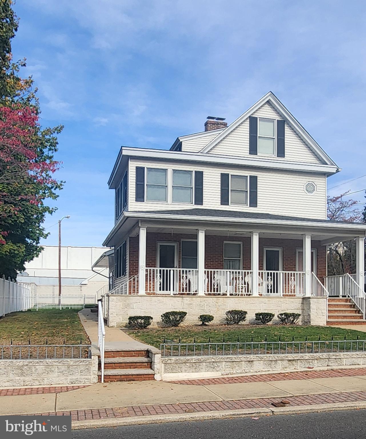 60 Pitman Avenue, Unit 60 Pitman, NJ 08071 - Photo 1 of 12 a front view of a house with a porch