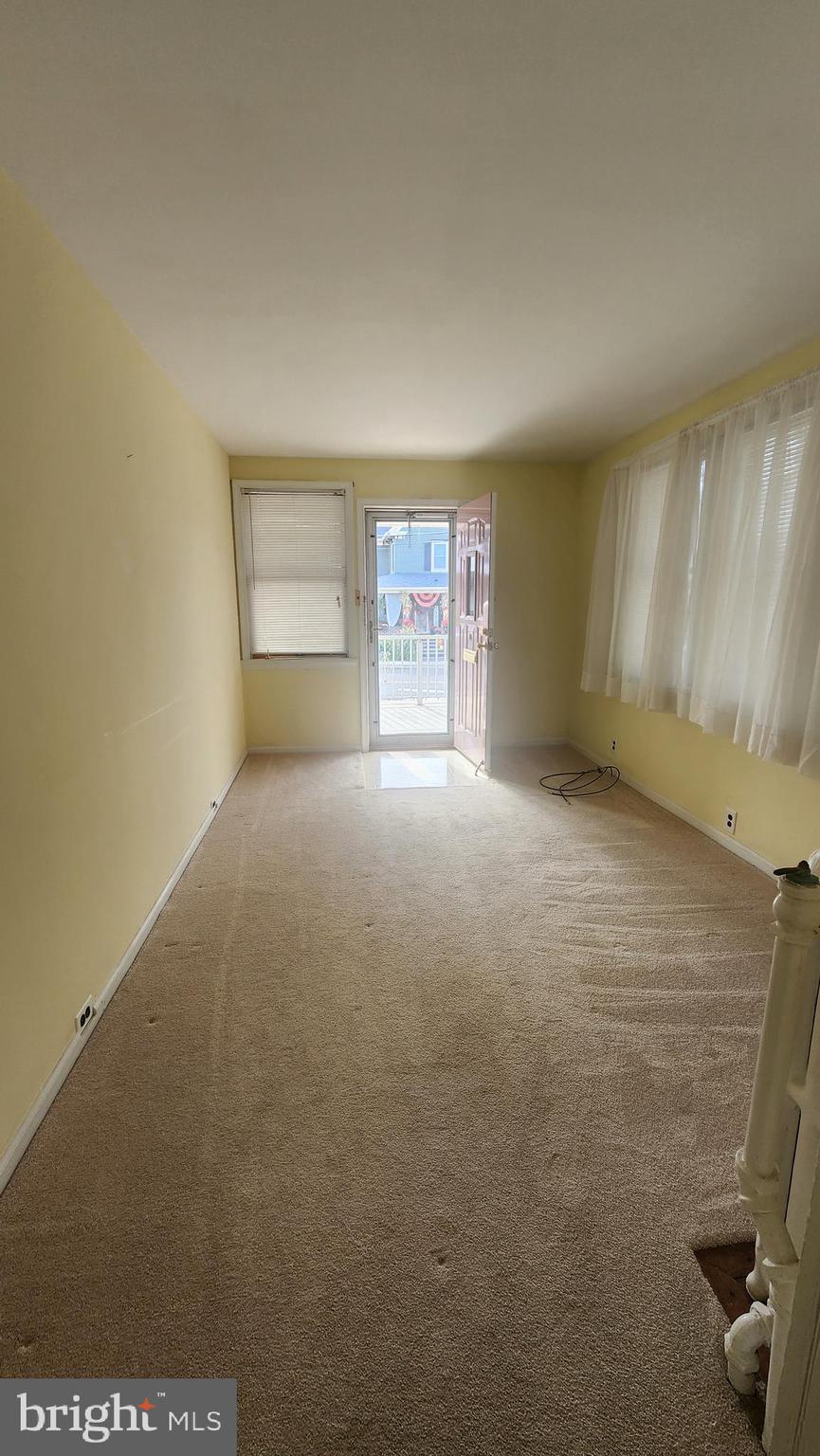 60 Pitman Avenue, Unit 60 Pitman, NJ 08071 - Photo 4 of 12 an empty room with windows