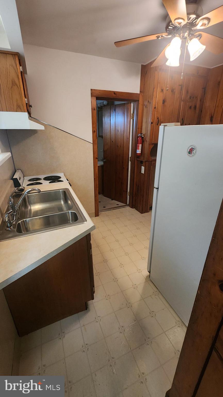60 Pitman Avenue, Unit 60 Pitman, NJ 08071 - Photo 7 of 12 a bathroom with a sink and a mirror