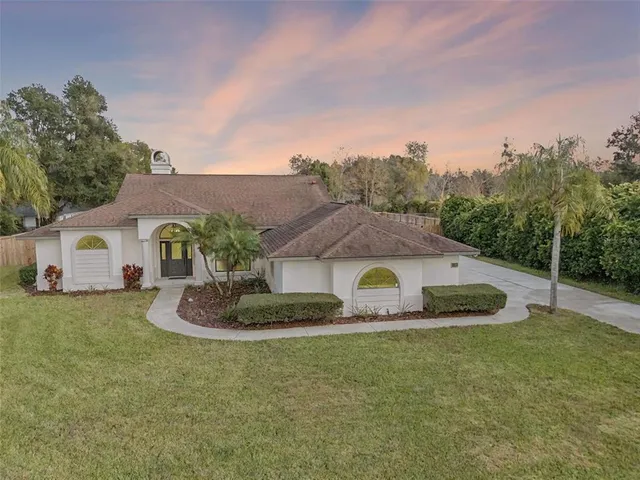 a house with trees in the background