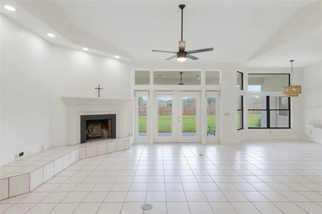 a view of an empty room with glass door