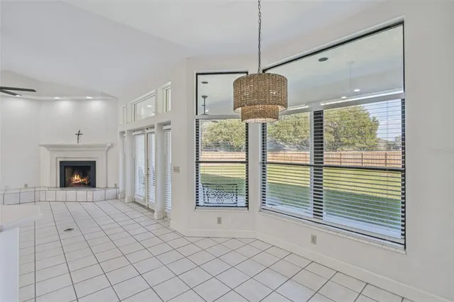 a view of livingroom with an empty space and fireplace