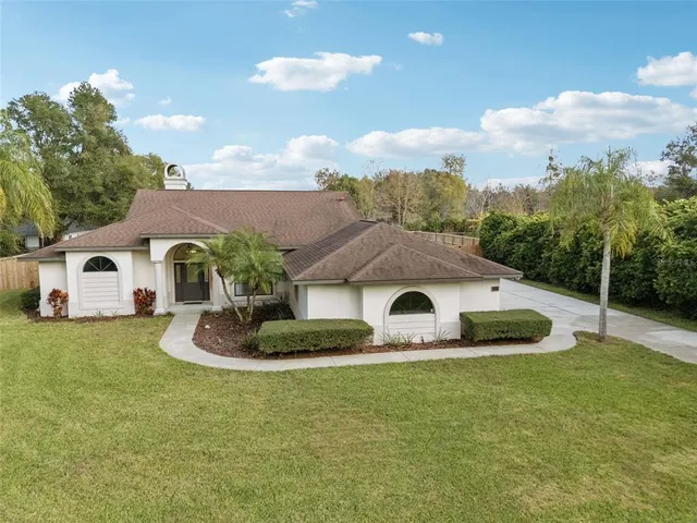 a house with trees in the background
