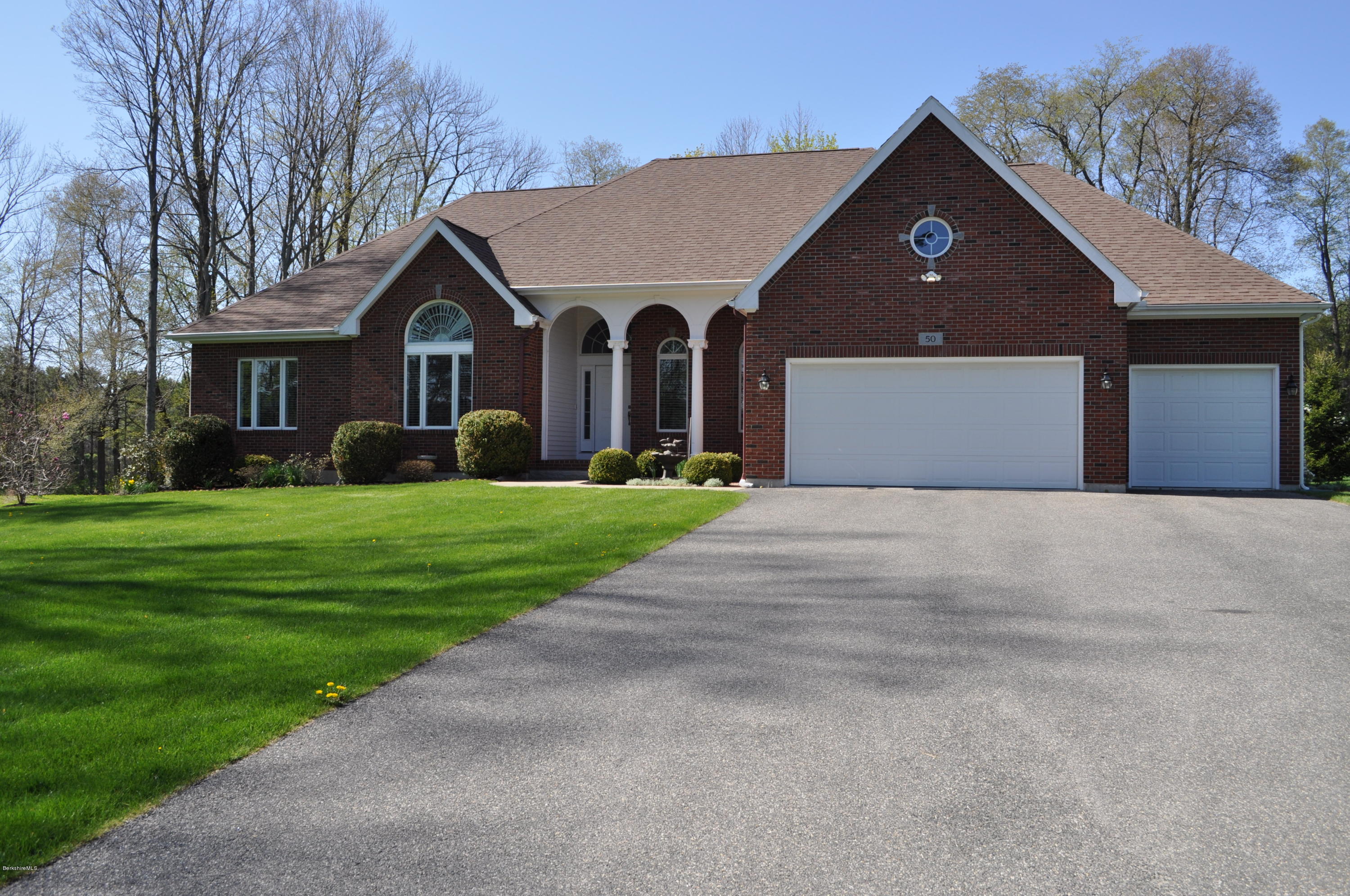 50 Stockbridge Road Lee, MA 01238 - Photo 2 of 27 a front view of house with yard and green space