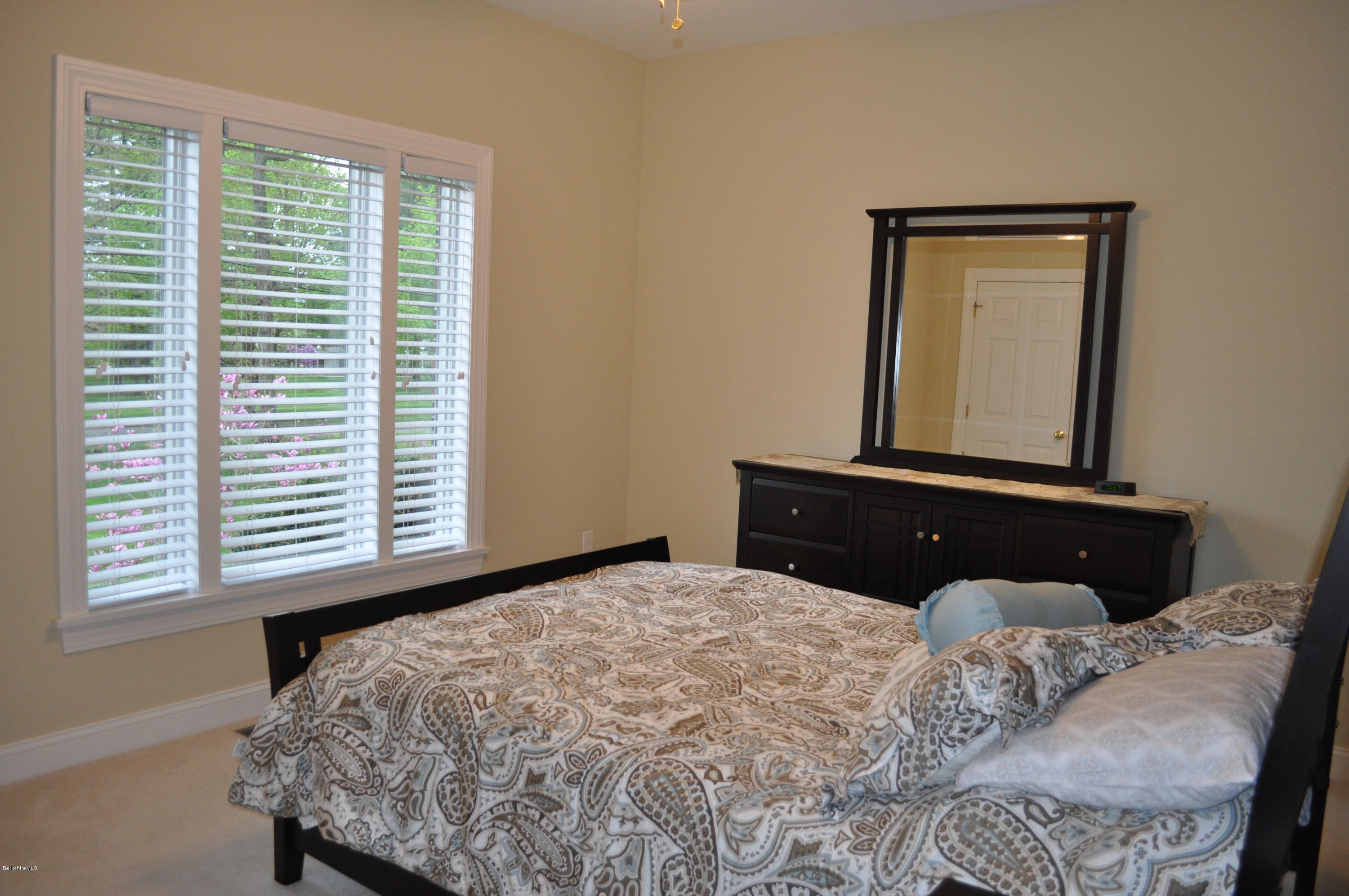 50 Stockbridge Road Lee, MA 01238 - Photo 20 of 27 a bedroom with a bed and a window