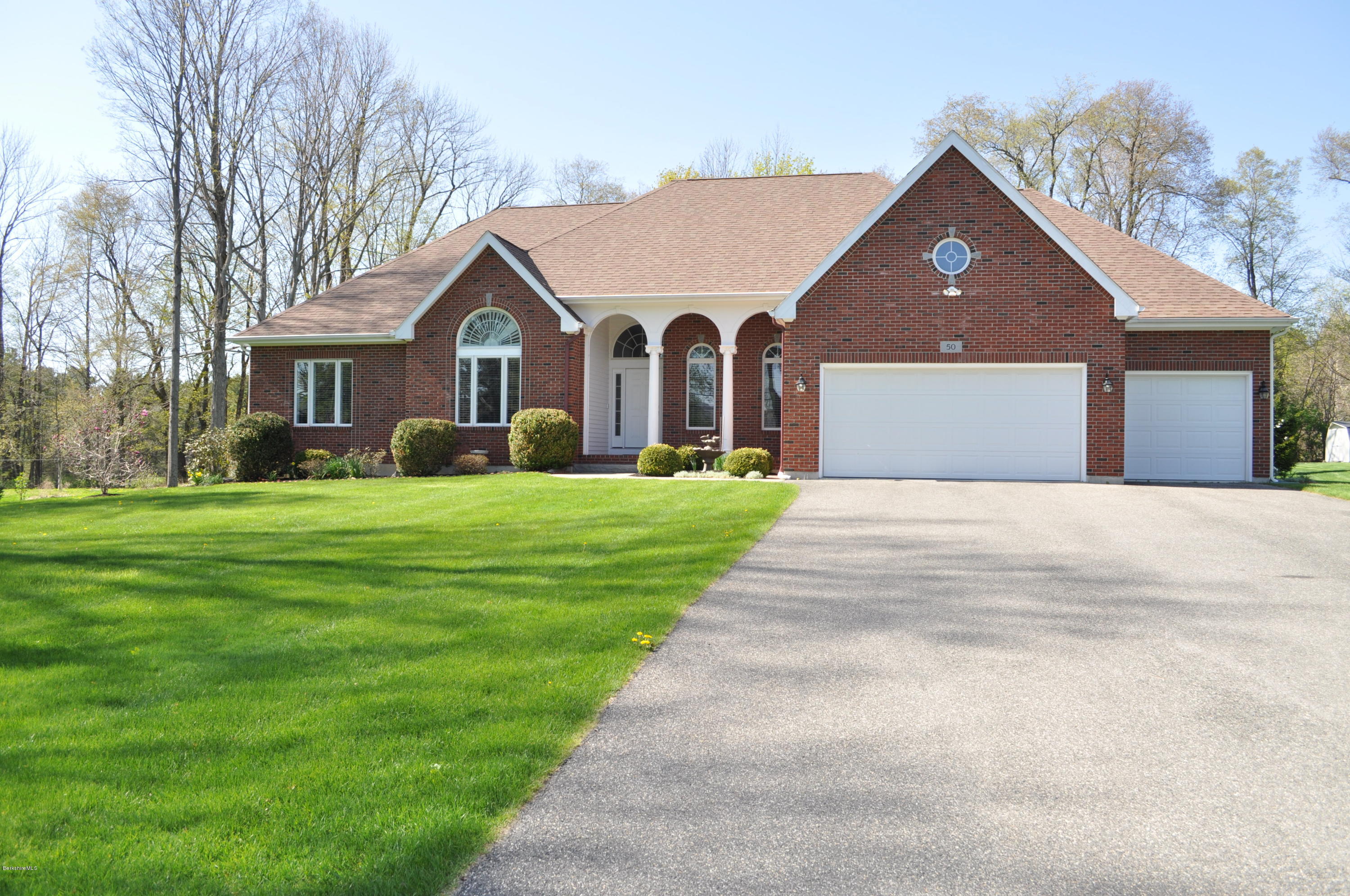 50 Stockbridge Road Lee, MA 01238 - Photo 3 of 27 a front view of house with yard and green space