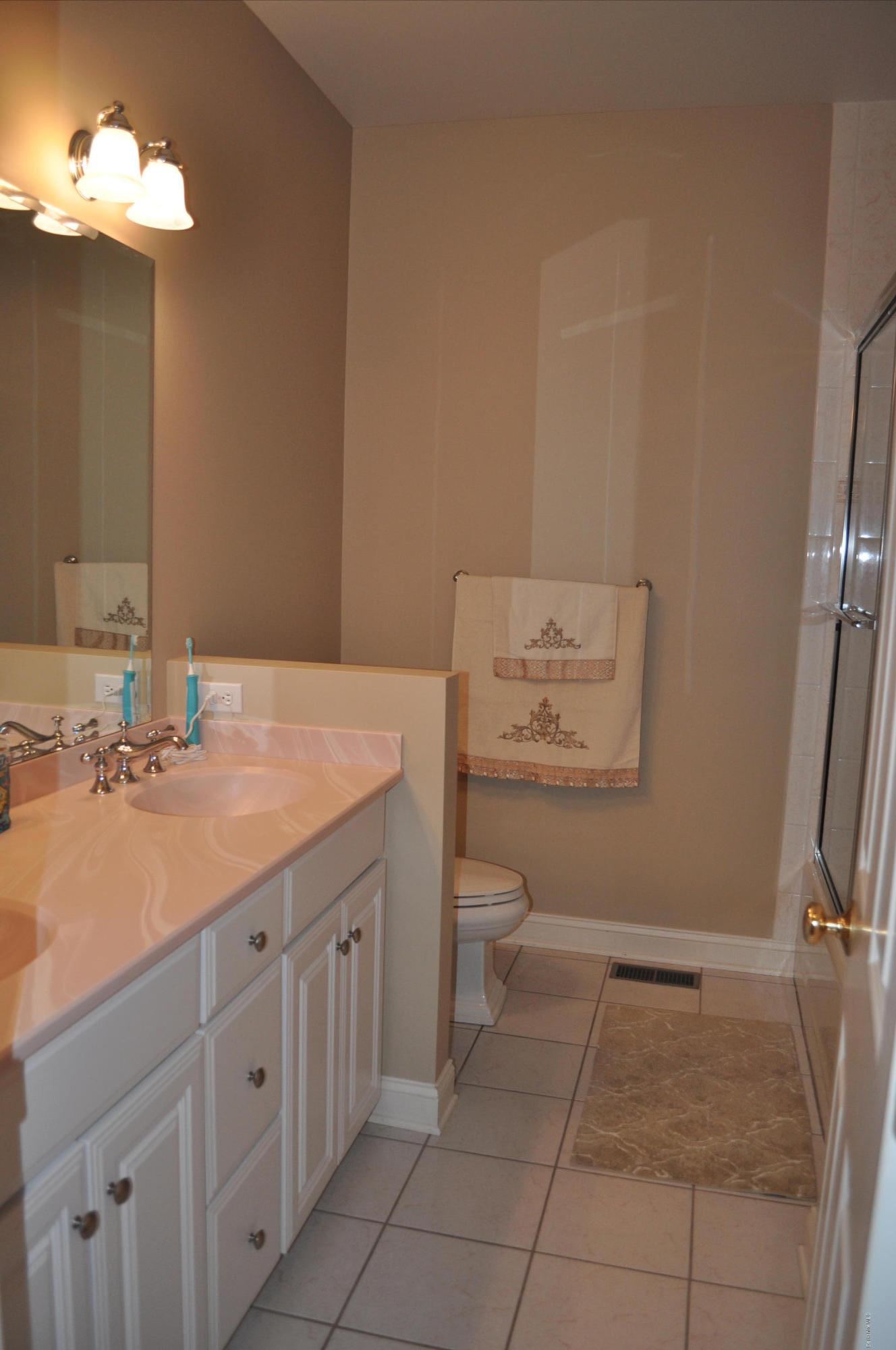 50 Stockbridge Road Lee, MA 01238 - Photo 22 of 27 a bathroom with a sink a toilet and a mirror