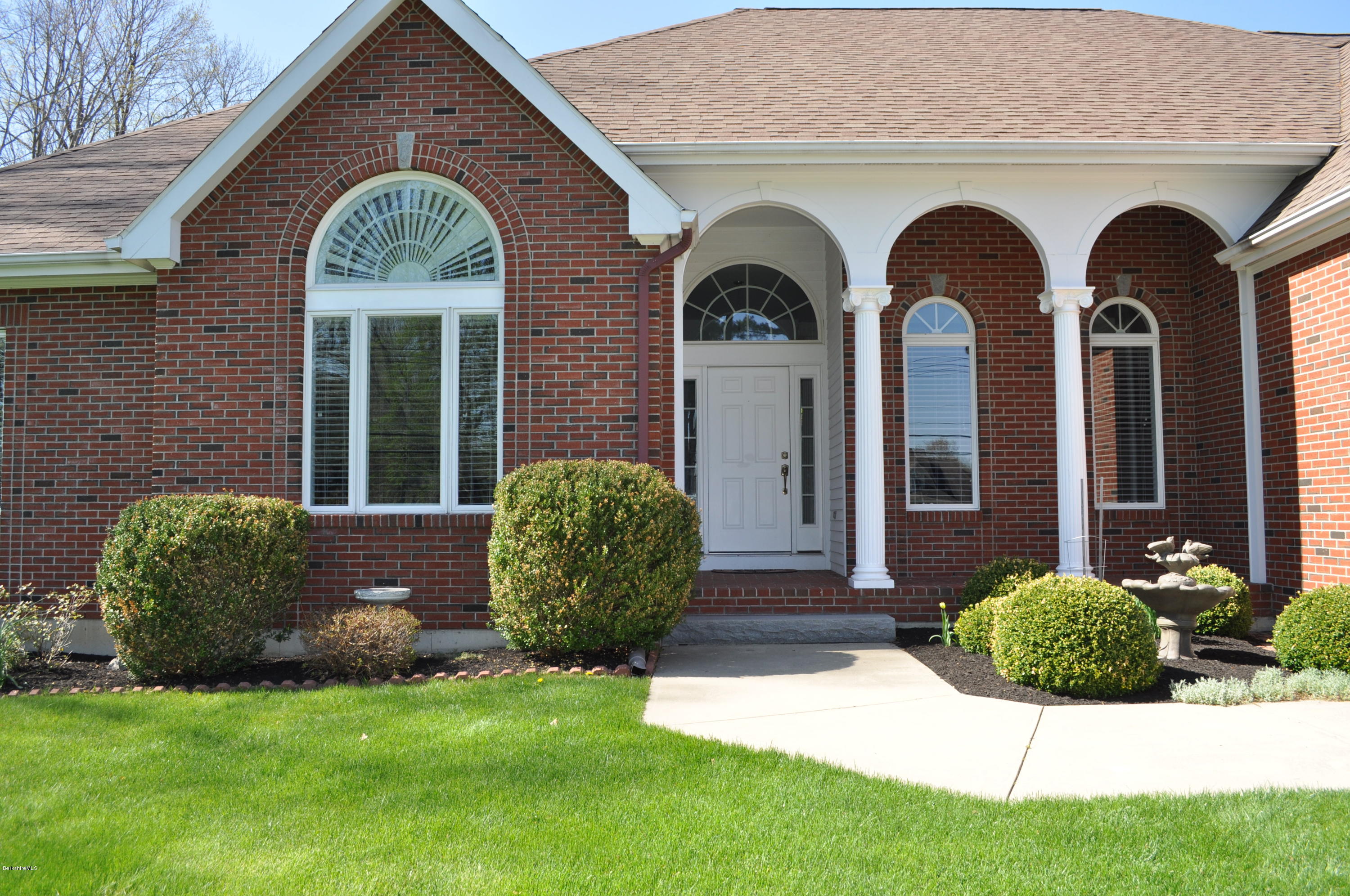 50 Stockbridge Road Lee, MA 01238 - Photo 4 of 27 a view of a brick house with a yard
