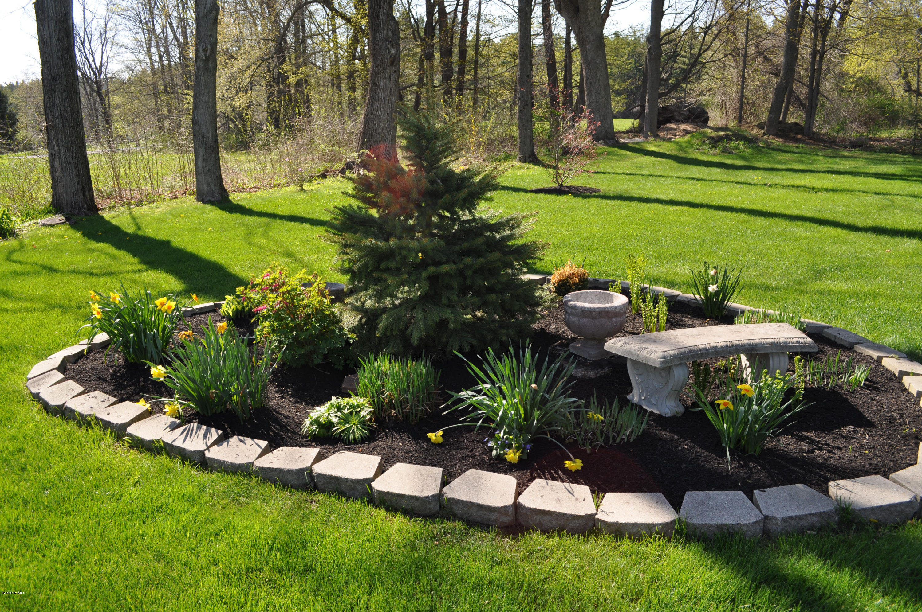 50 Stockbridge Road Lee, MA 01238 - Photo 7 of 27 a view of a golf course with a table and chairs