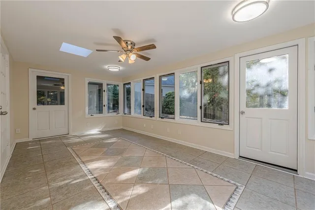 a view of an entryway with wooden floor and a window