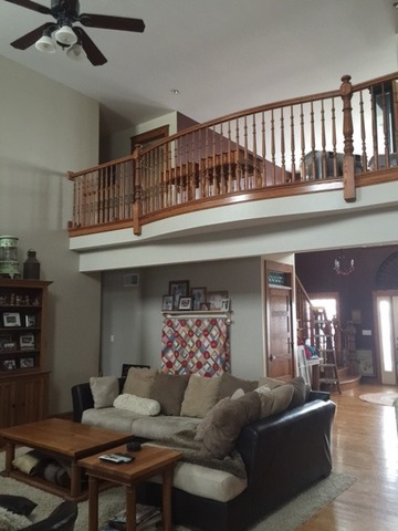 12663 West Offner Road Manhattan, IL 60442 - Photo 17 of 25 a living room with furniture and a chandelier