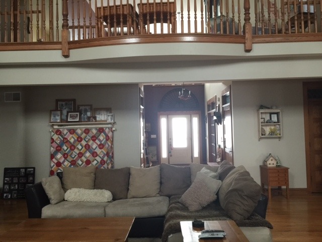 12663 West Offner Road Manhattan, IL 60442 - Photo 5 of 25 a living room with furniture and a painting on the wall