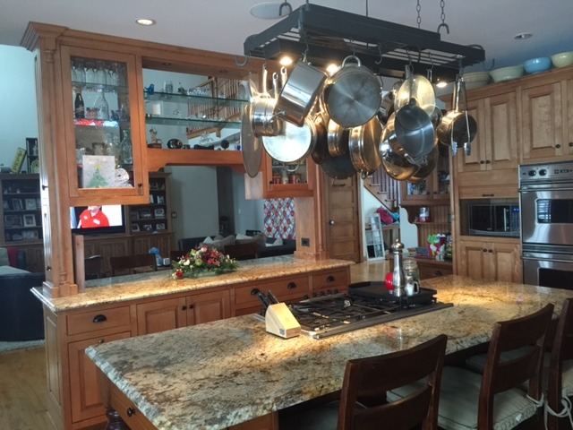 12663 West Offner Road Manhattan, IL 60442 - Photo 6 of 25 a kitchen area with granite countertop a table and chairs in it