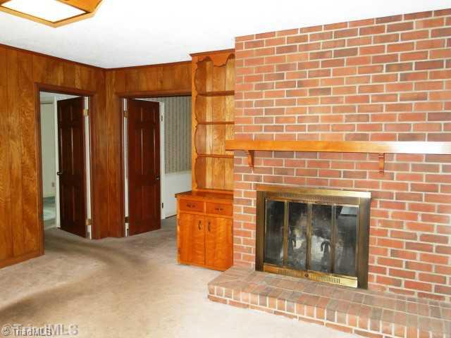 1406 Coventry Road High Point, NC 27262 - Photo 9 of 13 Den/Family/Great Room. Brick fireplace with bookshelves