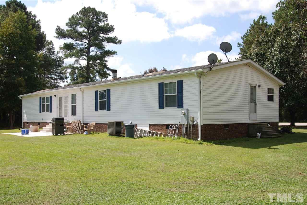 1298 O B J Road Dunn, NC 28334 - Photo 23 of 24 a front view of house with yard and green space