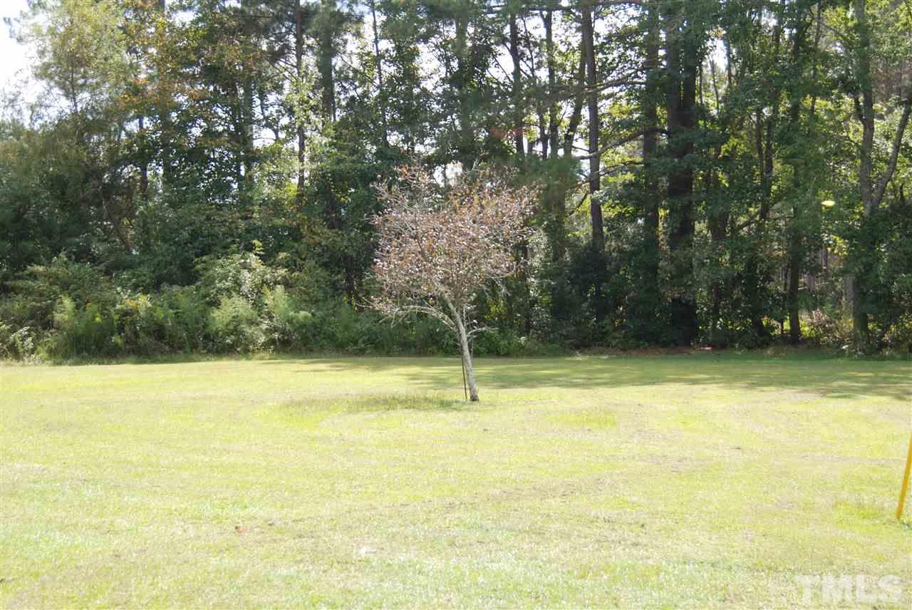 1298 O B J Road Dunn, NC 28334 - Photo 24 of 24 a view of a swimming pool with an outdoor space and seating area