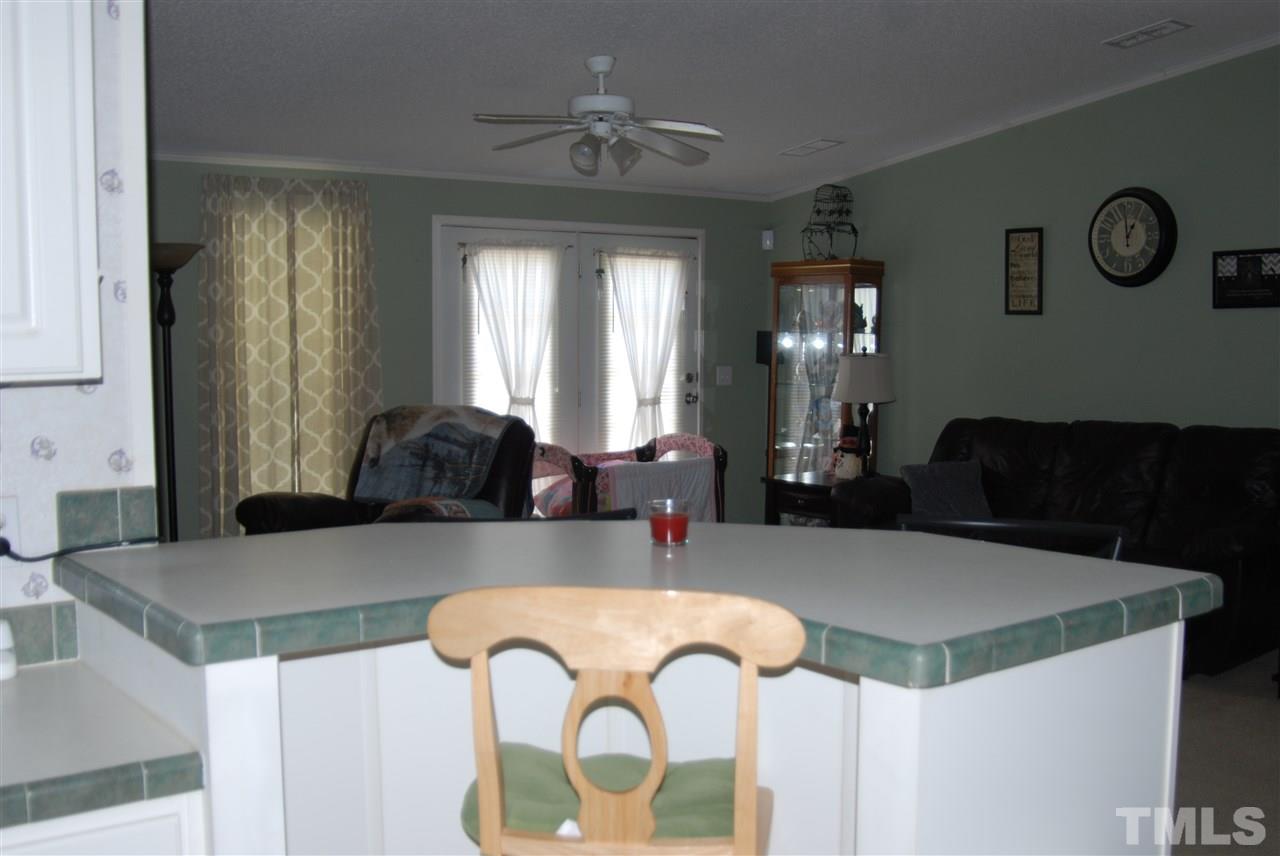 1298 O B J Road Dunn, NC 28334 - Photo 5 of 24 a view of kitchen island with granite countertop furniture