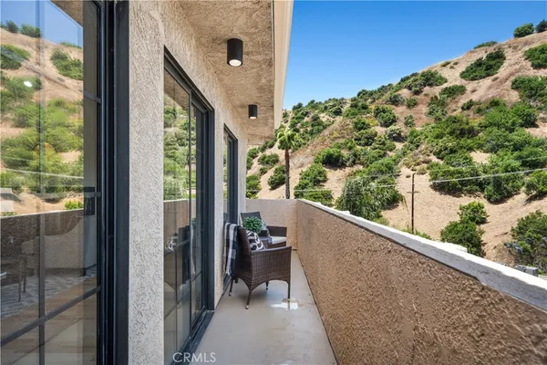a view of a balcony with mountain view