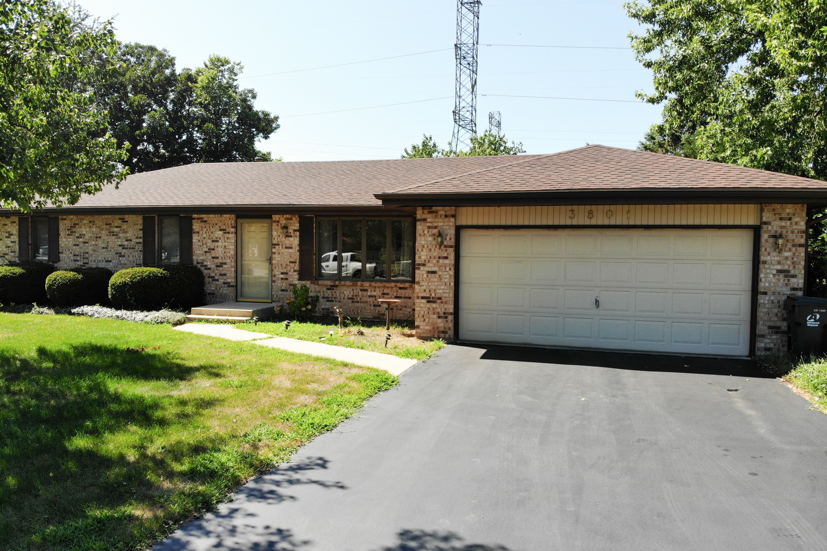 3801 Cutty Sark Road Cherry Valley, IL 61016 - Photo 1 of 25 a front view of a house with a yard and garage