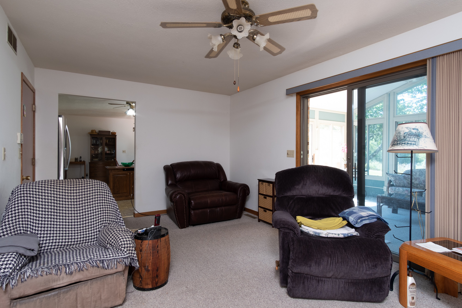 3801 Cutty Sark Road Cherry Valley, IL 61016 - Photo 11 of 25 a living room with furniture and a floor to ceiling window
