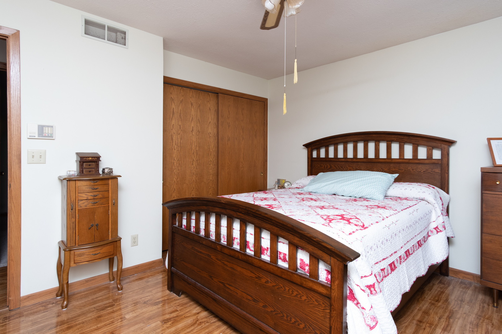 3801 Cutty Sark Road Cherry Valley, IL 61016 - Photo 15 of 25 a bedroom with a bed and wooden floor