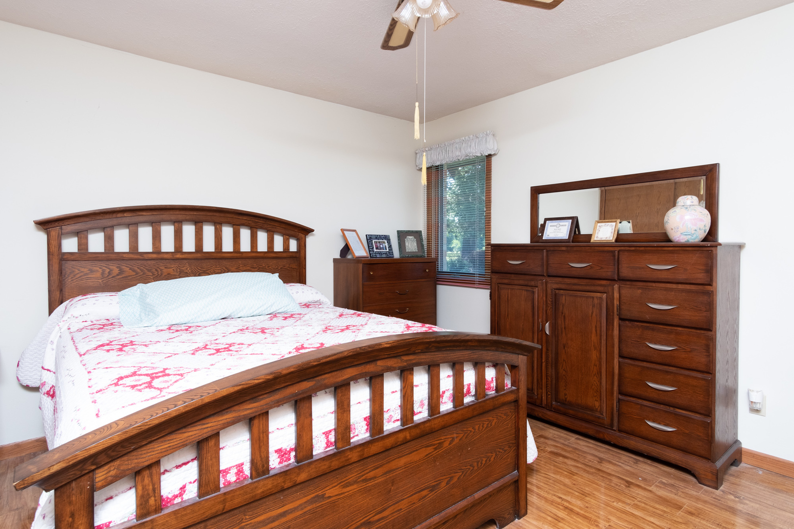 3801 Cutty Sark Road Cherry Valley, IL 61016 - Photo 16 of 25 a bedroom with a bed and a dresser