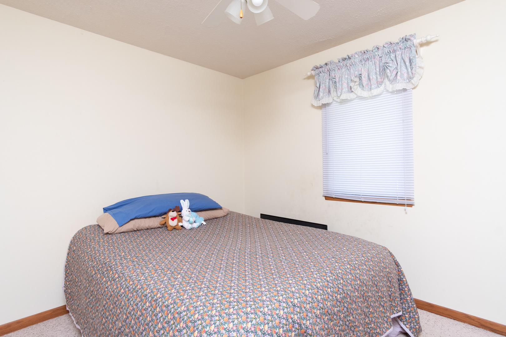 3801 Cutty Sark Road Cherry Valley, IL 61016 - Photo 18 of 25 a bedroom with a bed and a chandelier