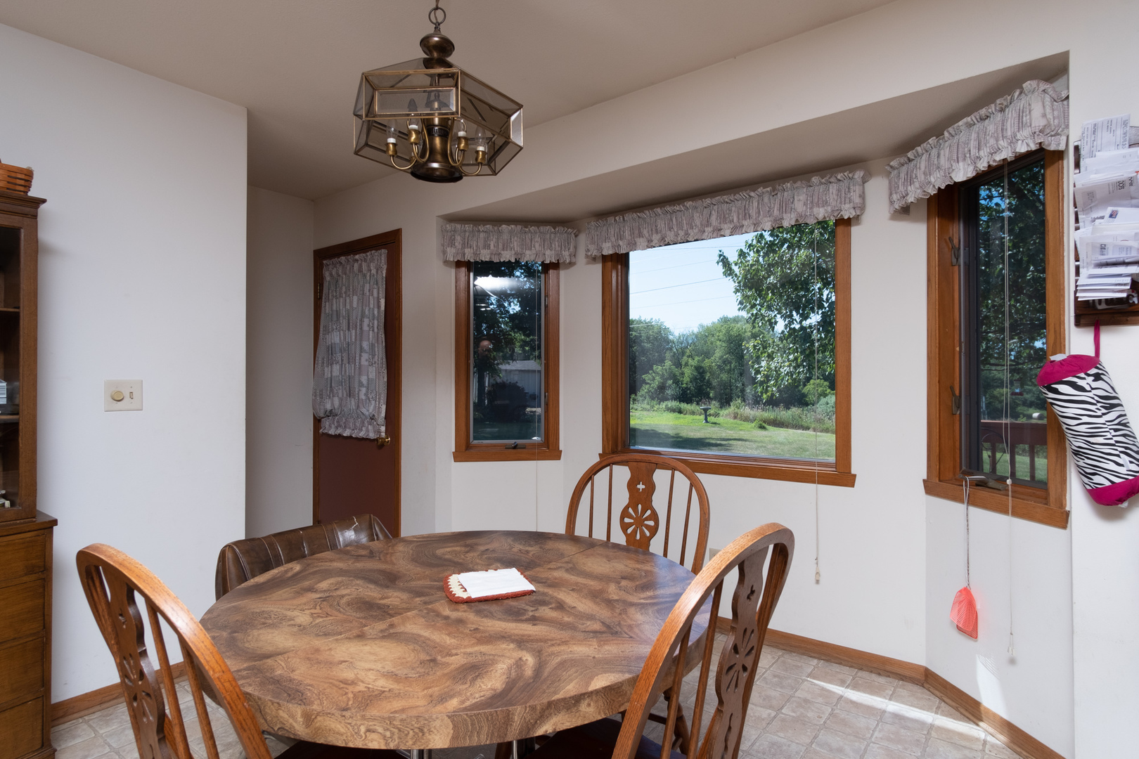 3801 Cutty Sark Road Cherry Valley, IL 61016 - Photo 9 of 25 a view of a dining room with furniture window and outside view