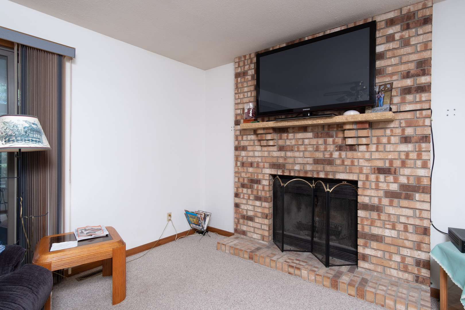 3801 Cutty Sark Road Cherry Valley, IL 61016 - Photo 10 of 25 a living room with fireplace and a flat screen tv