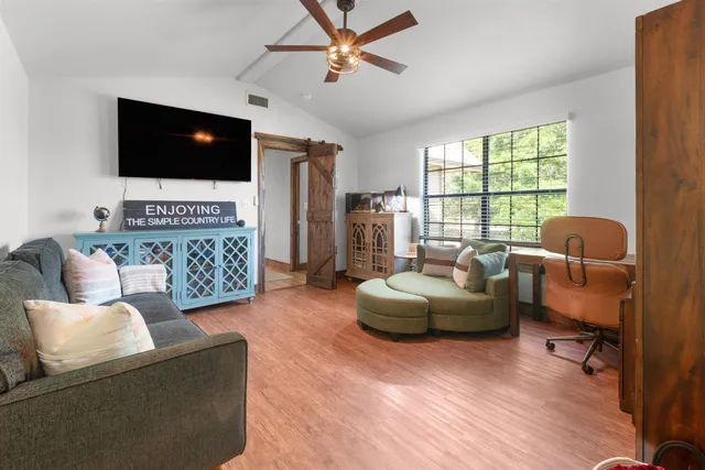 an aerial view of a house with a yard