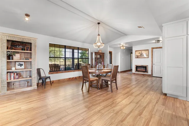 a kitchen with stainless steel appliances granite countertop a sink a stove top oven a counter space and cabinets